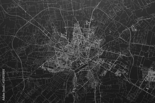 Street map of Lublin (Poland) on black paper with light coming from top