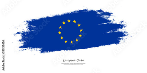 Happy Europe Day of European Union. National flag on artistic stain brush stroke background.