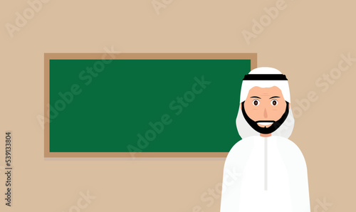 Arabic Teacher standing in front of the blackboard