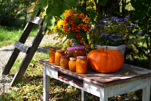 Wallpaper Mural Vintage still life with jars of pumkin jam and fall flowers on the old table in the garden outside Torontodigital.ca