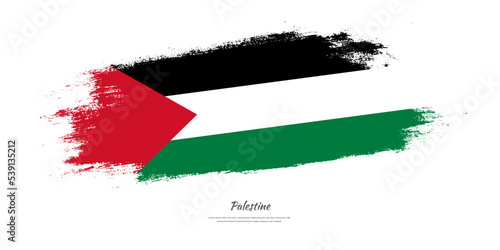 Happy Independence Day of Palestine. National flag on artistic stain brush stroke background.