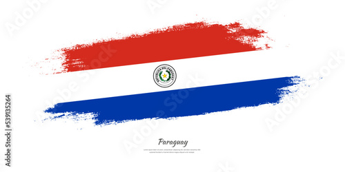 Happy Independence Day of Paraguay. National flag on artistic stain brush stroke background.