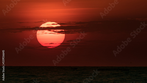 African sunset  with warm sun setting on the horizon of Lake Victoria  Tanzania.