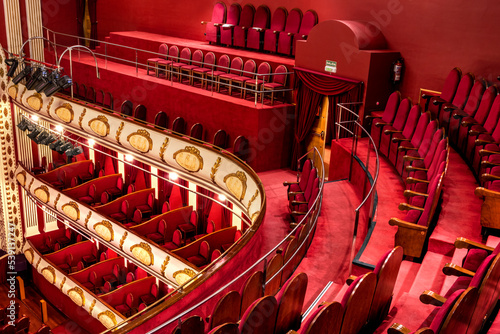 Red velvet seats in a theater in Villena, Spain. photo