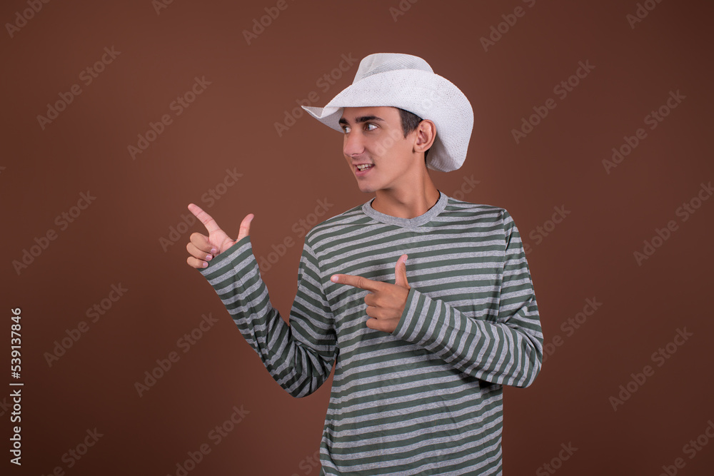 Funny man traveler. Guy on a brown background. Copy space. Funny man traveler. Guy on a brown background. Copy space.
