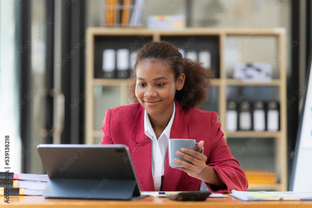 Smiling young black businesswoman working with partner at office. finance concept.