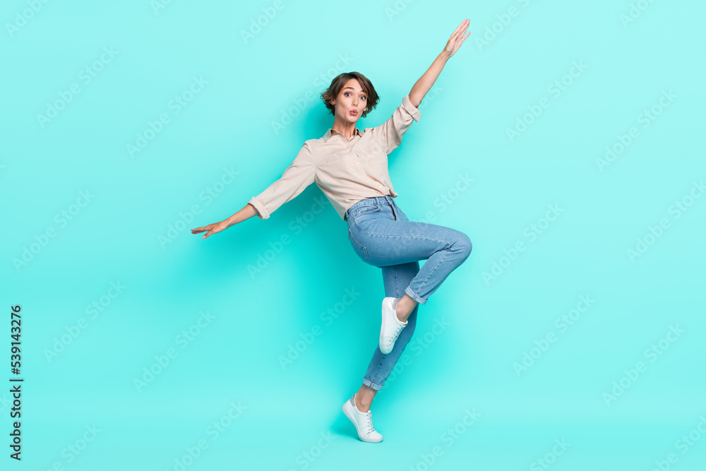 Full length photo of astonished lovely lady dressed nice clothes open arm falling down chasm empty space isolated cyan color background