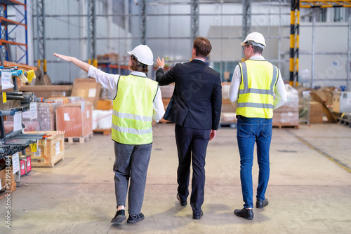 manager visit staff in storage warehouse and have some discussion with site team and walk around factory inspection