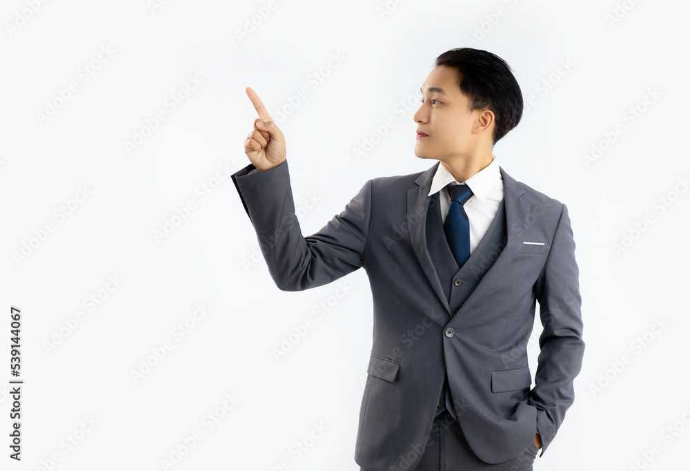 Young asian businessman in grey color posing finger pionting and touching on white background.
Young asian businessman in grey color posing finger pionting and touching on white background.