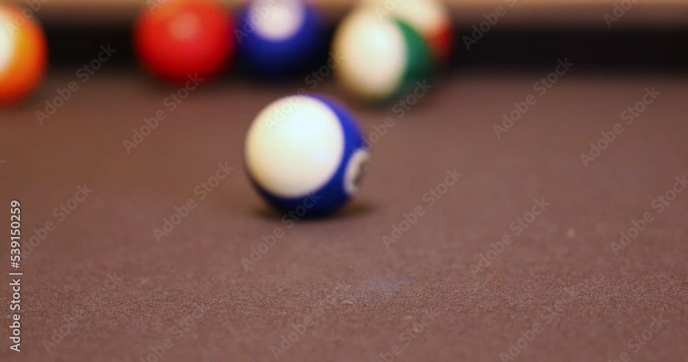 Billiard Balls Hitting And Rolling On The Pool Table. Playing Eightball Billiards. close up