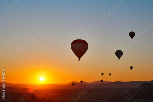 Balloons at dusk in Cappadocia. Famous flight in Goreme. Turkey © h368k742