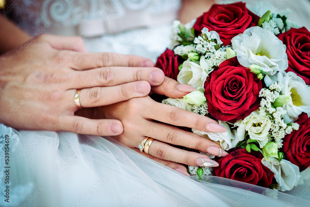 The bride holds a wedding bouquet in her hands, wedding day flowers. The bride holds a wedding bouquet in her hands, wedding day flowers.