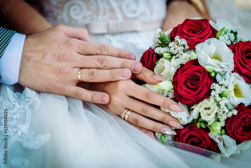The bride holds a wedding bouquet in her hands, wedding day flowers. The bride holds a wedding bouquet in her hands, wedding day flowers.