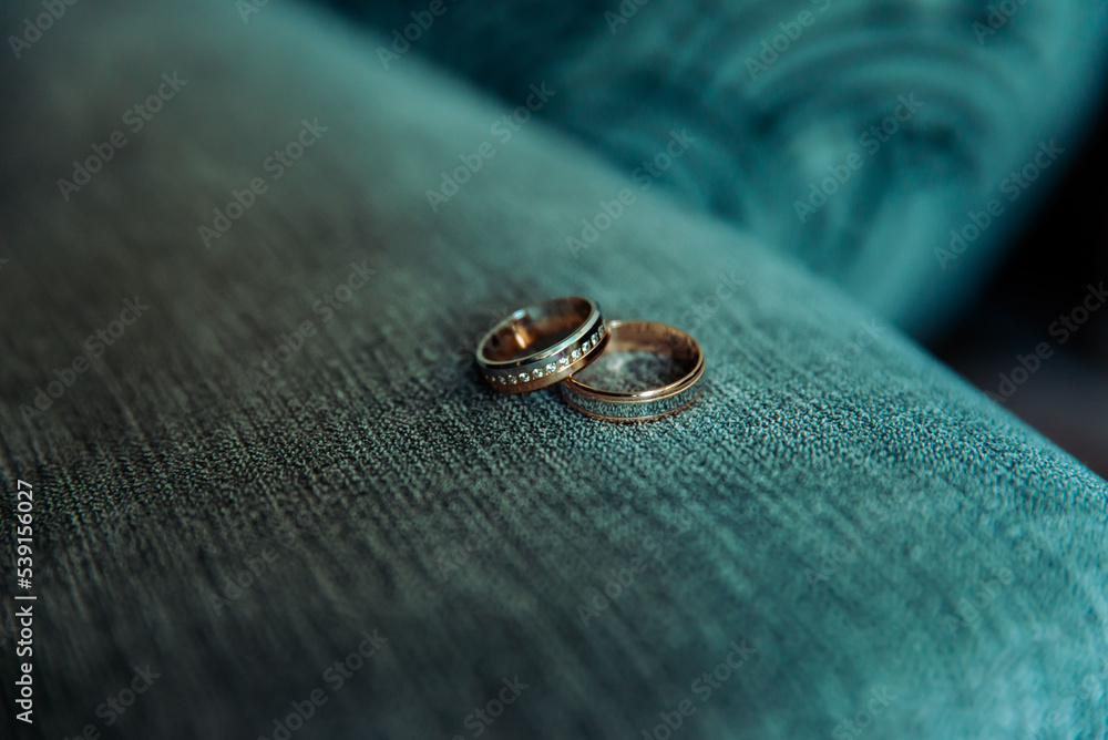Two wedding rings on the floor with contrast Two wedding rings on the floor with contrast