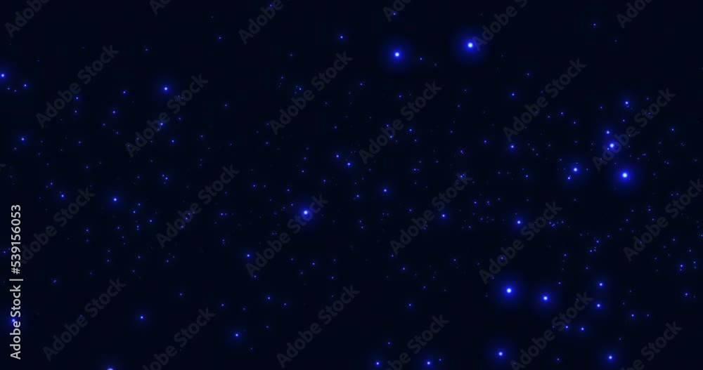 Luminous blue particles moving in space on a blue background. An abstract star cluster, deep space. Bokeh. Luminous blue particles moving in space on a blue background. An abstract star cluster, deep space. Bokeh.