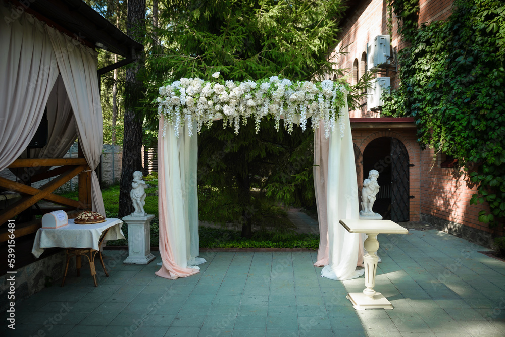 Wedding ceremony. wedding arch, decorated with various fresh flowers