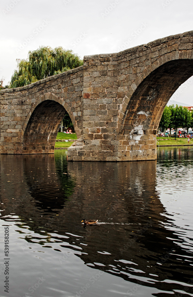 Fototapeta premium Old stone bridge over river