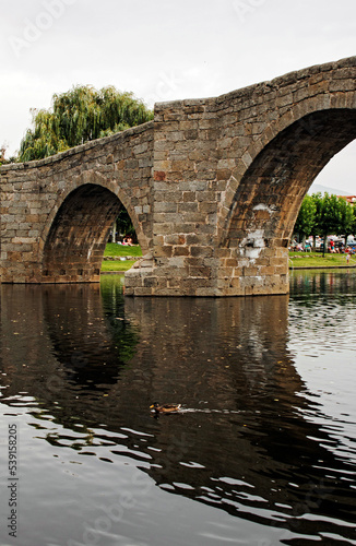 Old stone bridge over river © Nacho