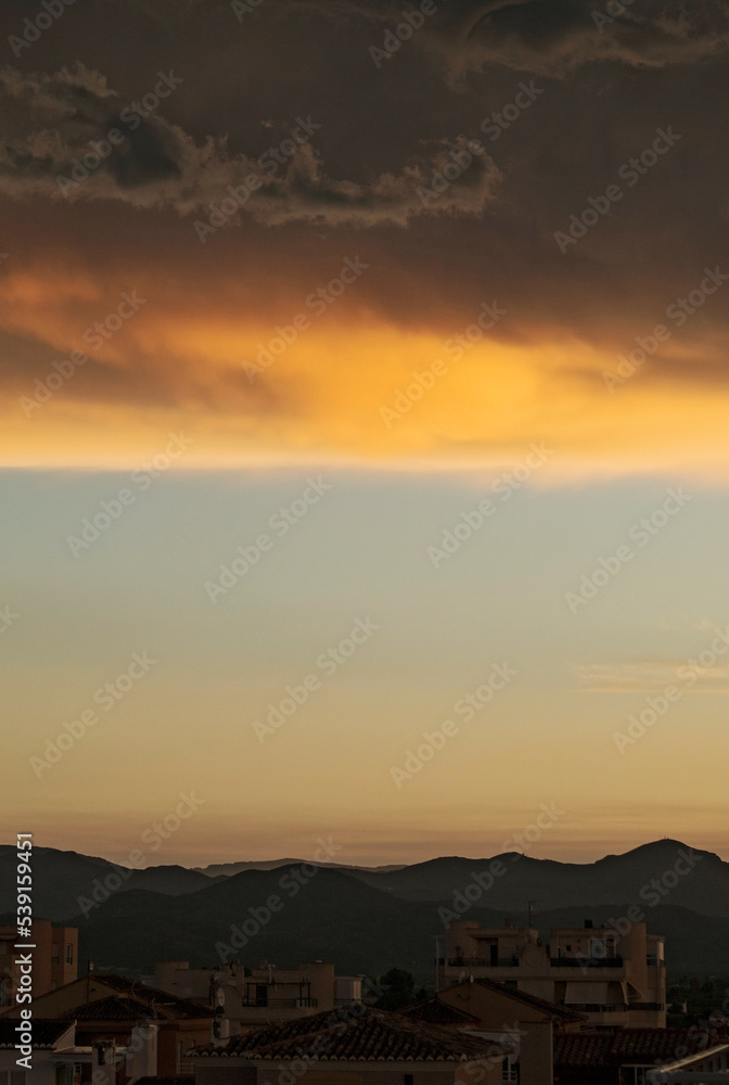 Fototapeta premium A golden sunset with clouds