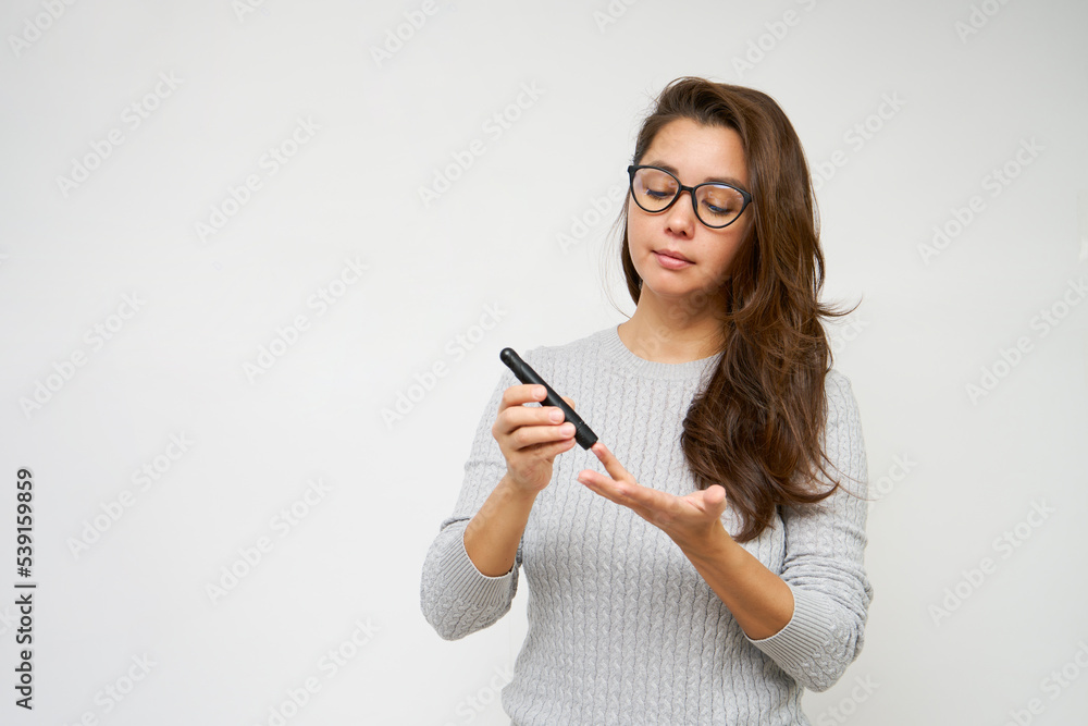 custom made wallpaper toronto digital Woman checking diabetes test, white background with copy space