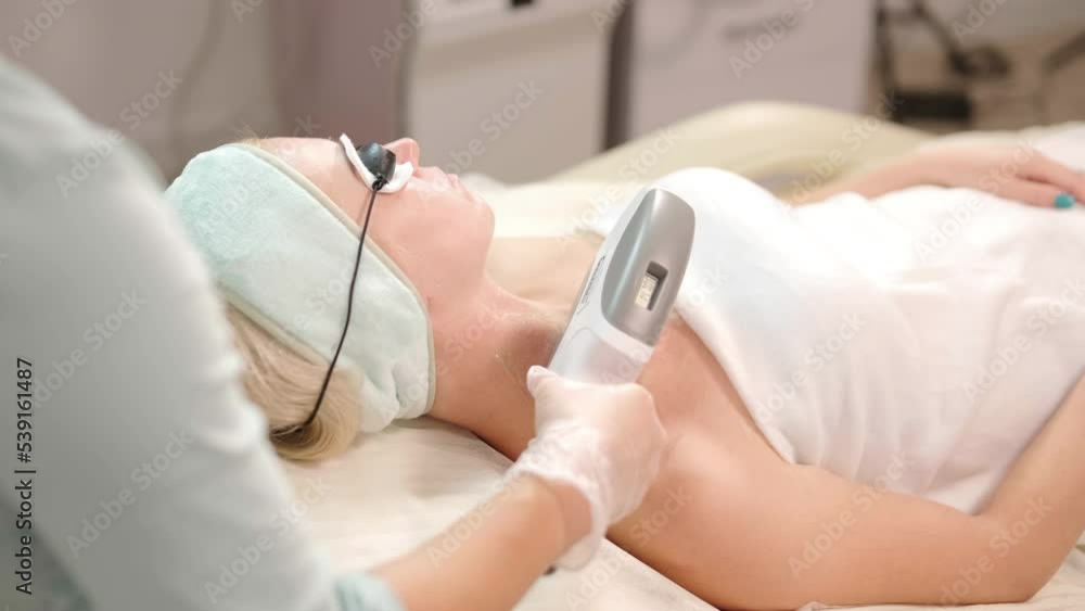 ELOS skin rejuvenation procedure. Female with cooling gel ELOS skin rejuvenation procedure. Female with cooling gel