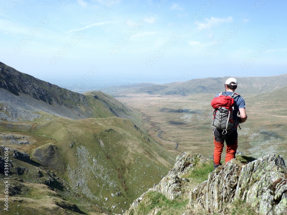 Fototapeta premium Scotland, Snowdonia. Hiking and climbing ridges through the wilderness during Spring time. Some days are sunny some days are rainy, but all of them are an adventure 