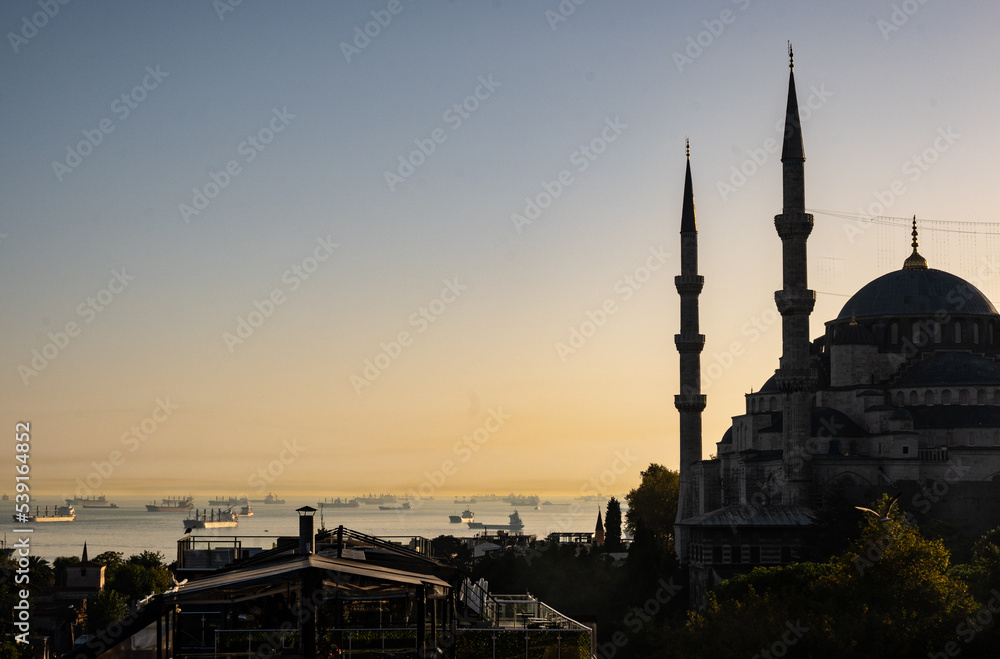 Ayia Sofia in beautiful summer evening with ships on the horizon