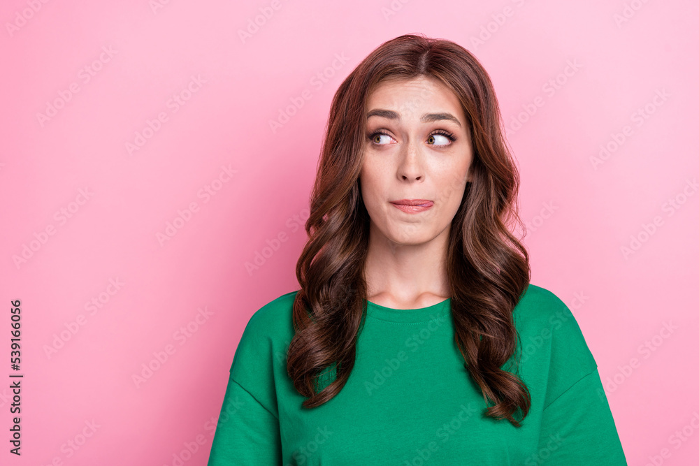 Photo of nice curious funny woman with wavy hairdo dressed green t-shirt look empty space lick lips isolated on pink color background Photo of nice curious funny woman with wavy hairdo dressed green t-shirt look empty space lick lips isolated on pink color background