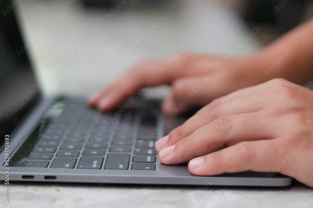 work on laptop on the marble table indoors or outdoors work on laptop on the marble table indoors or outdoors