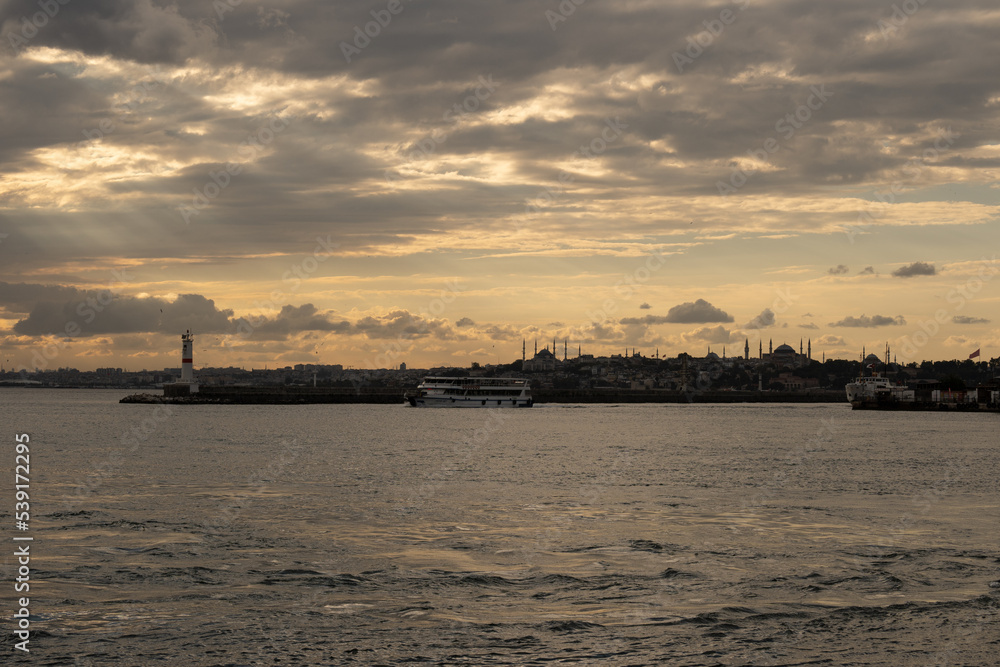 Marvelous yellow mystical dramatic sky over Istanbul over a the port of in Kadiköy