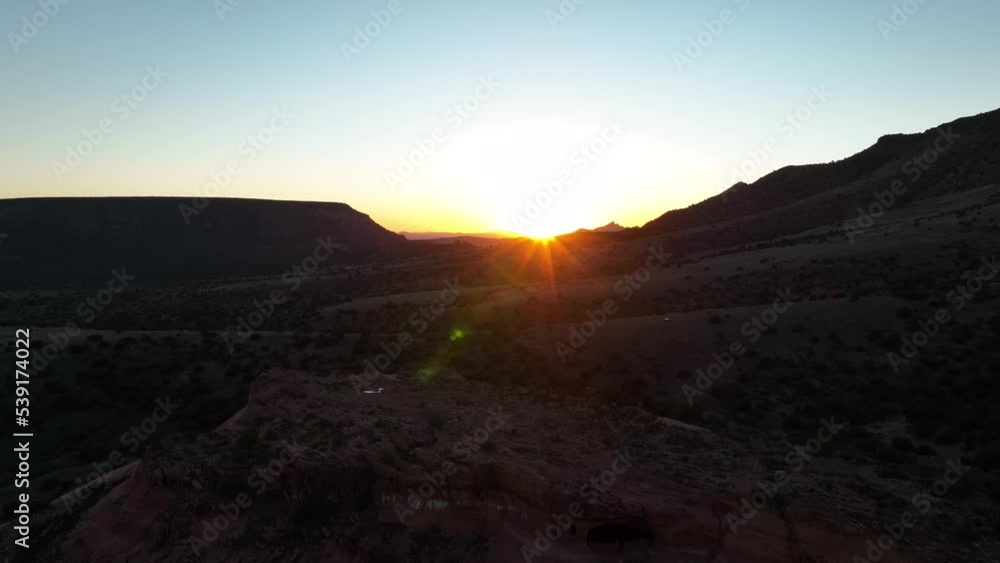 Aerial View Of Landscape Amidst Rock Formations During Sunset In Sedona, Arizona - drone shot Aerial View Of Landscape Amidst Rock Formations During Sunset In Sedona, Arizona - drone shot
