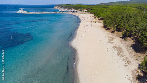 Drone view of crystal clear blue water on the beach of Kabatepe near Çanakkale, Turkey photo