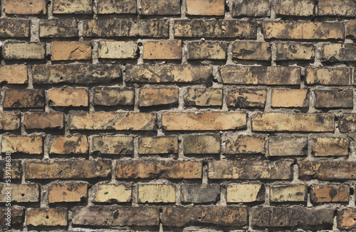 Old brick wall in brown color, antique grungy texture, blank background with space for text.