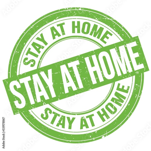 STAY AT HOME text written on green round stamp sign