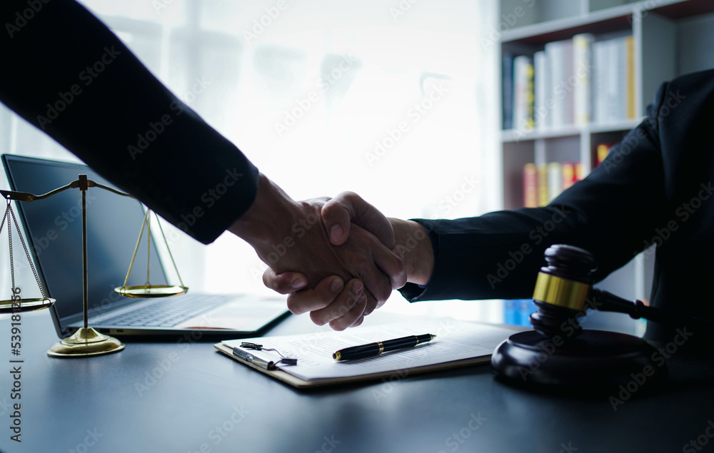 Lawyer businessmฟn working with contract papers and wooden gavel on table in courtroom. Justice and law, attorney, court judge, concept. Lawyer businessmฟn working with contract papers and wooden gavel on table in courtroom. Justice and law, attorney, court judge, concept.