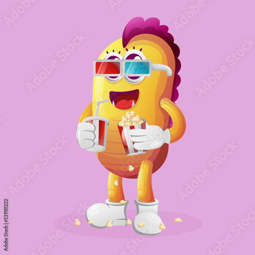 Cute yellow monster watching movie with holding soda and popcorn