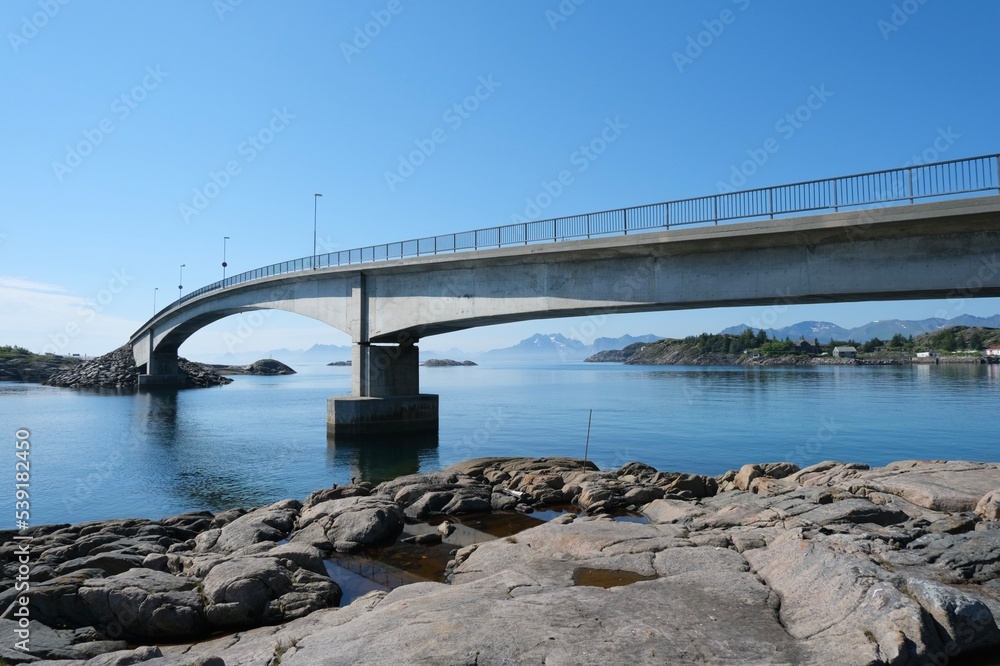 Fototapeta premium Fjord bridge on the blue sea and blue sky background