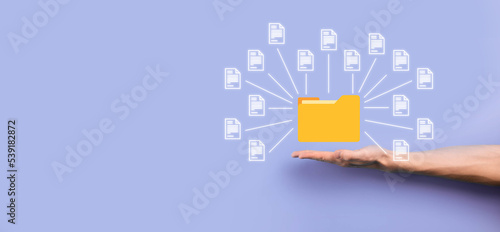 Document Management System DMS .Businessman hold folder and document icon.Software for archiving, searching and managing corporate files and information.Internet Technology Concept.Digital security.