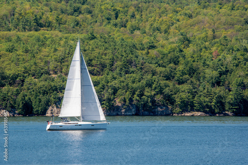 Sailboat sailing in Willsboro Lake Champlain Bay