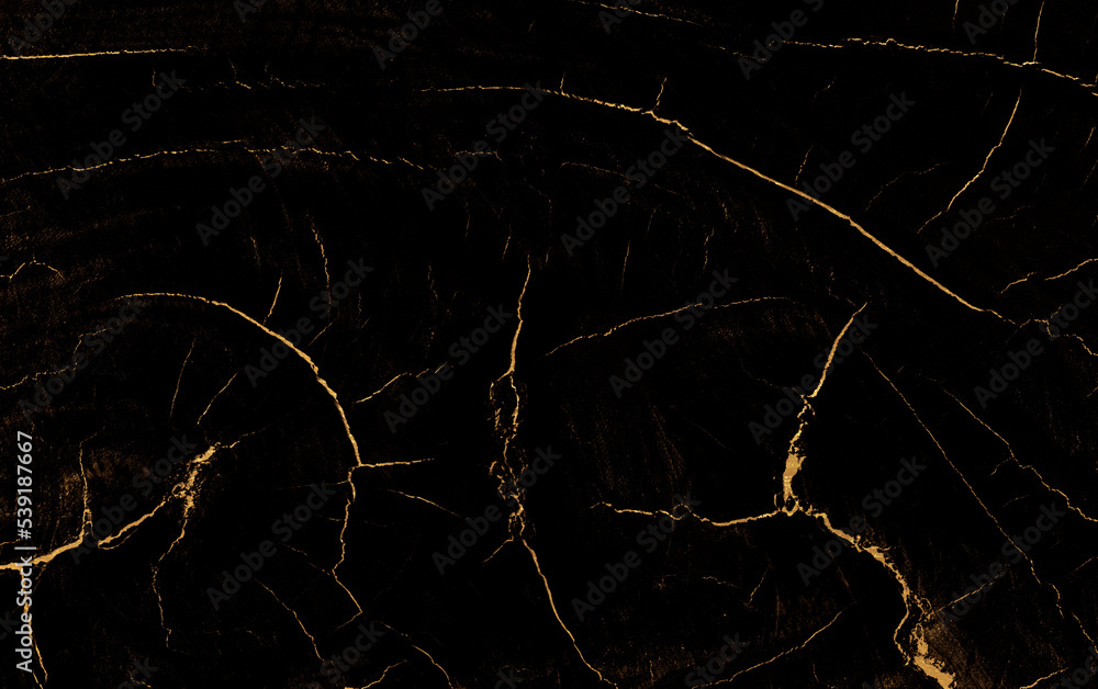 Obraz premium Czarny kamień ze złotymi pęknięciami