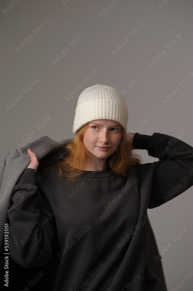 © Юрий Горид - young girl model in white cap and gray coat isolated on grey background. Product photo mockup for fashion brands and marketplaces. © Юрий Горид - young girl model in white cap and gray coat isolated on grey background. Product photo mockup for fashion brands and marketplaces.