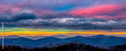 scenic wintry landscape with colorful sky
