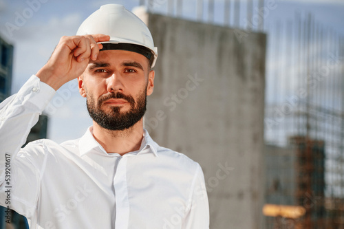 Portrait of man that is in uniform on the construction site © standret