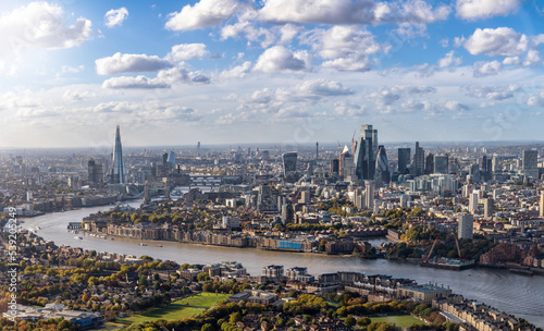 High panorama of the London skyline along the river Thames from London Bridge until the City during a sunny day, United Kingdom 