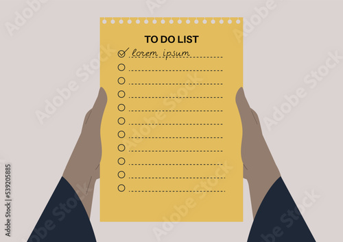 Hands holding a to-do list with empty check boxes and lines