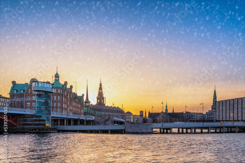 Copenhagen Denmark, sunset city skyline at Harbour with winter snow photo