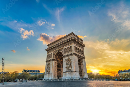 Fototapeta Paris France sunset city skyline at Arc de Triomphe and Champs Elysees