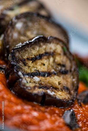 grilled aubergines with vegetables closeup