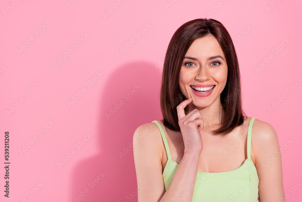 Photo of sweet shiny young girl dressed green outfit smiling finger chin isolated pink color background Photo of sweet shiny young girl dressed green outfit smiling finger chin isolated pink color background