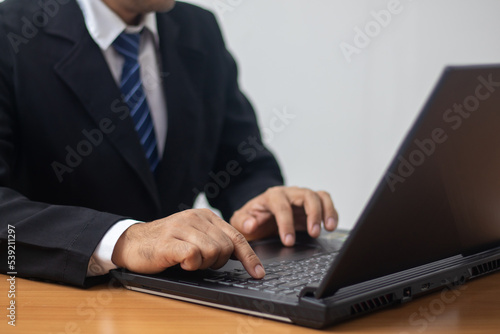 businessman using laptop to work © vachiravit